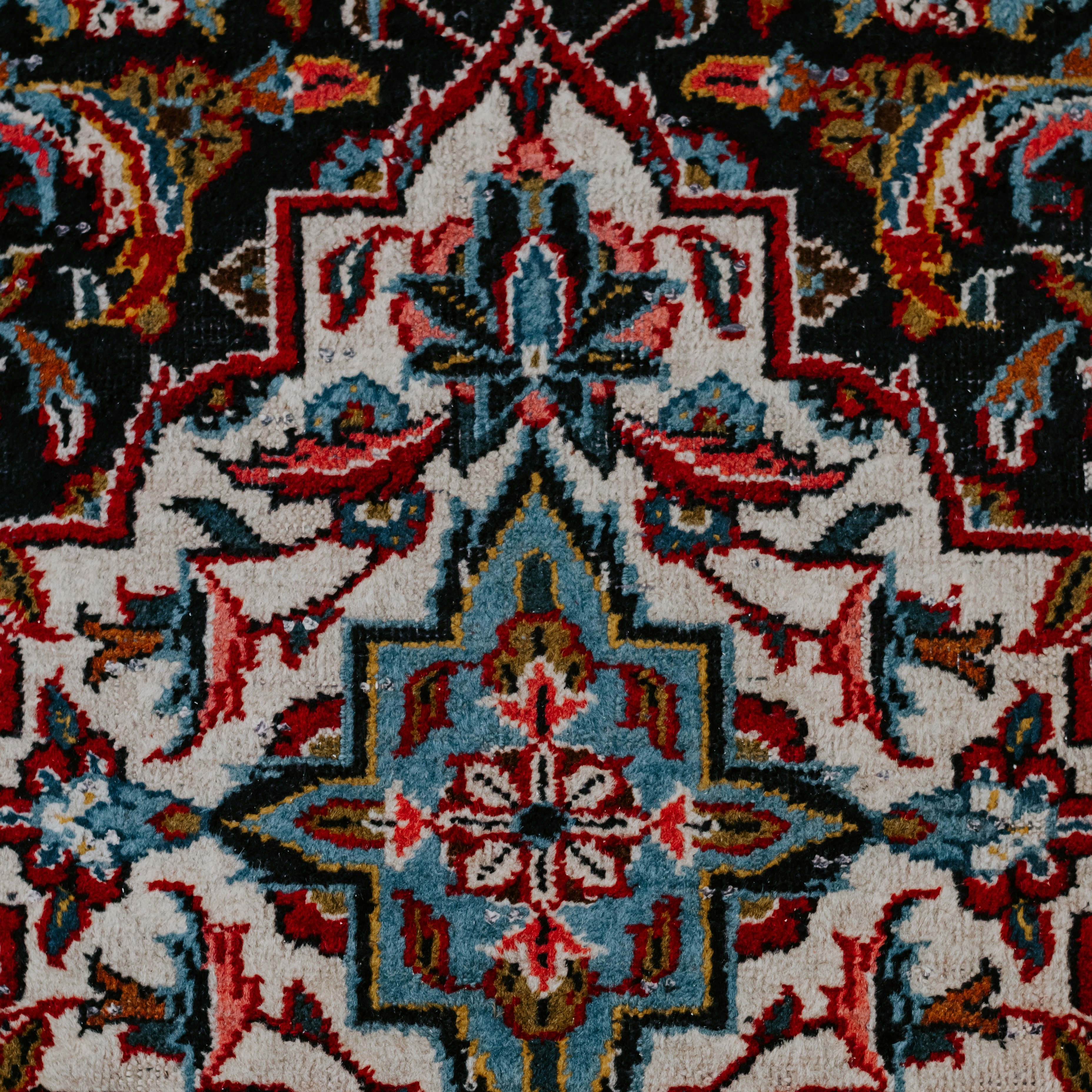 red white and black floral textile