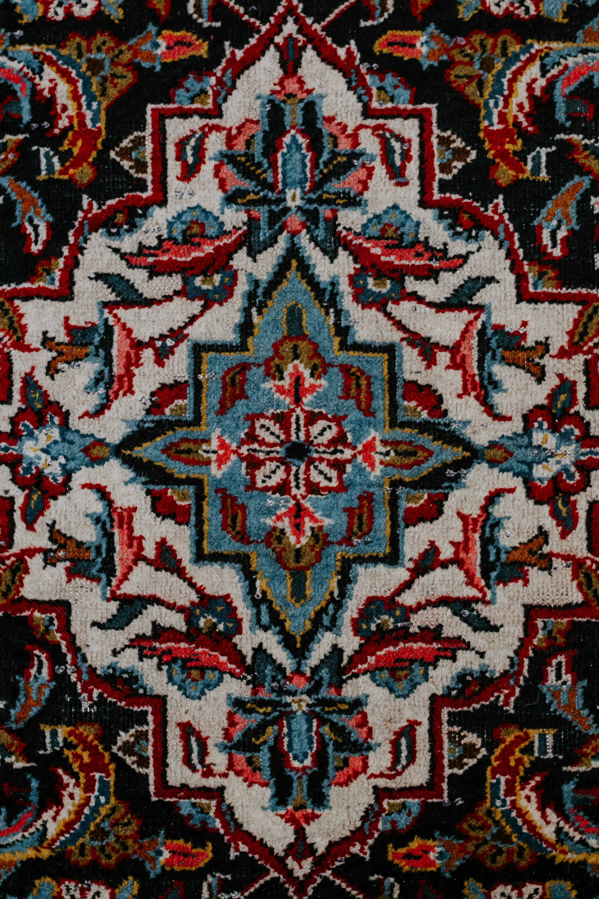 red white and black floral textile