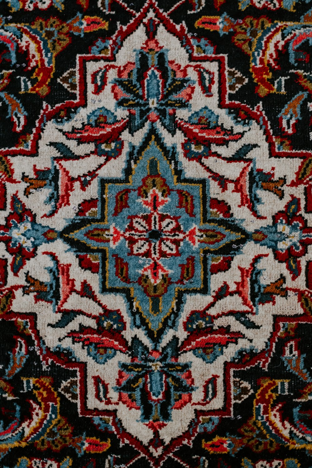 red white and black floral textile