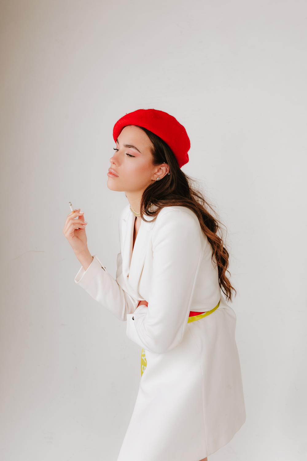 woman in white long sleeve shirt wearing red hat