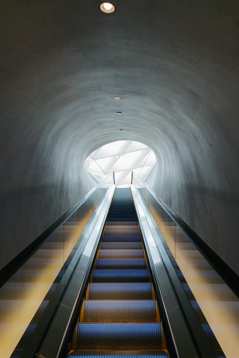 brown and white tunnel with staircase