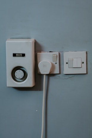 white wall mounted switch on white wall