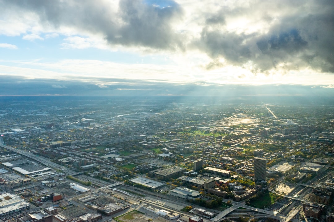 aerial view of city buildings under cloudy sky during daytime