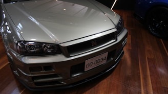 A silver sedan shining after a fresh installation of performance parts.