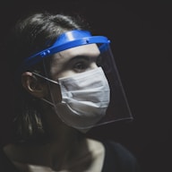 woman in white face mask