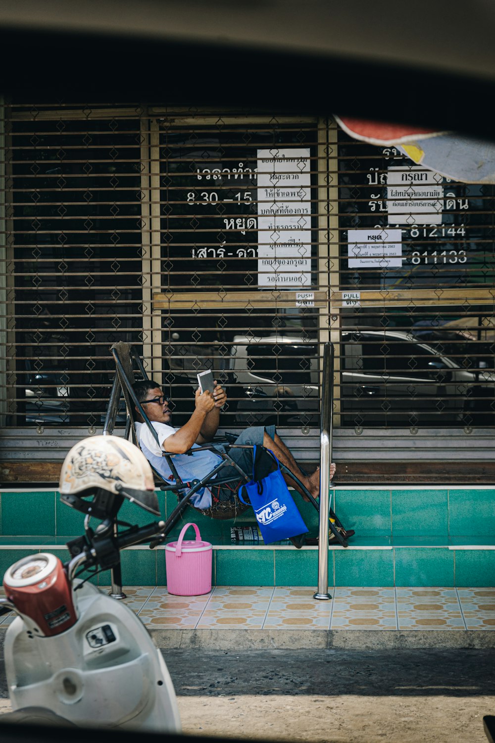 woman in black tank top and white helmet sitting on chair