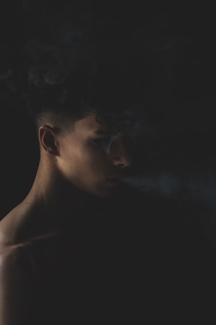 Portraits of historical pioneers emerging from swirling dark mist with gold accents.