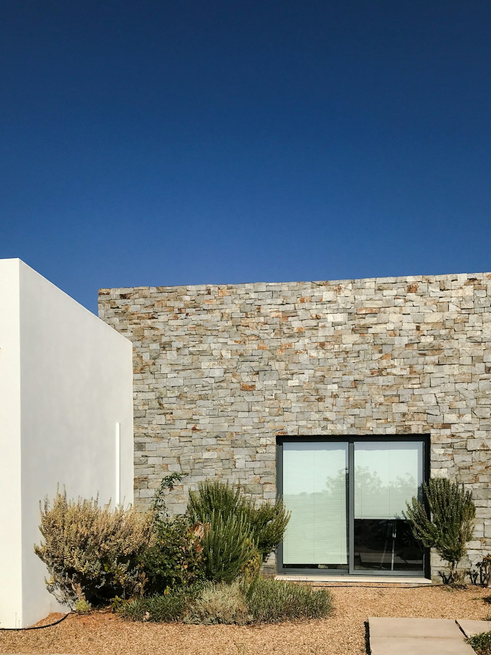 white concrete building with glass window