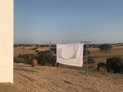 A serene landscape with clothing items displayed.