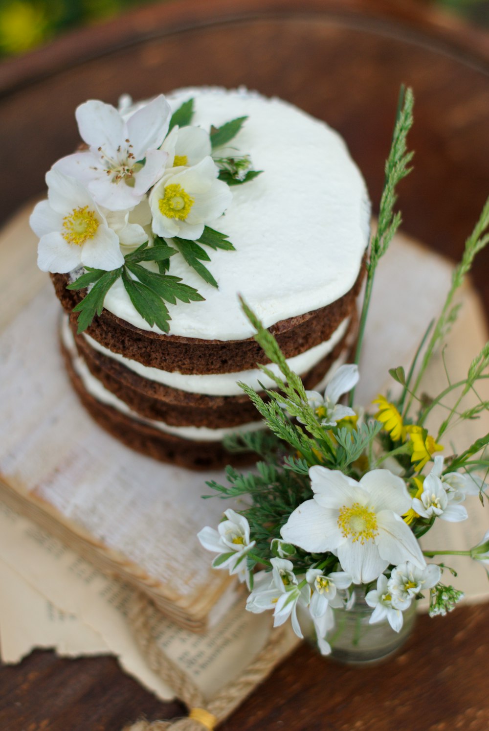 white flowers on brown wooden surface