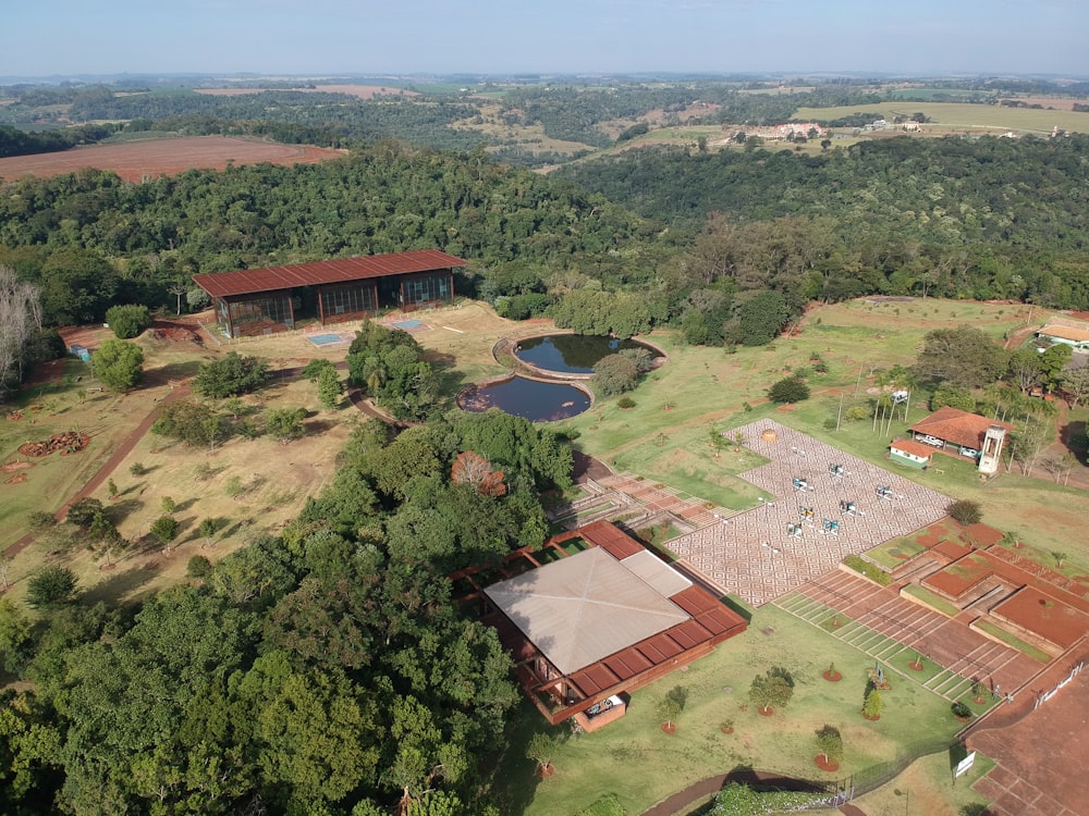 aerial view of green trees and brown house during daytime