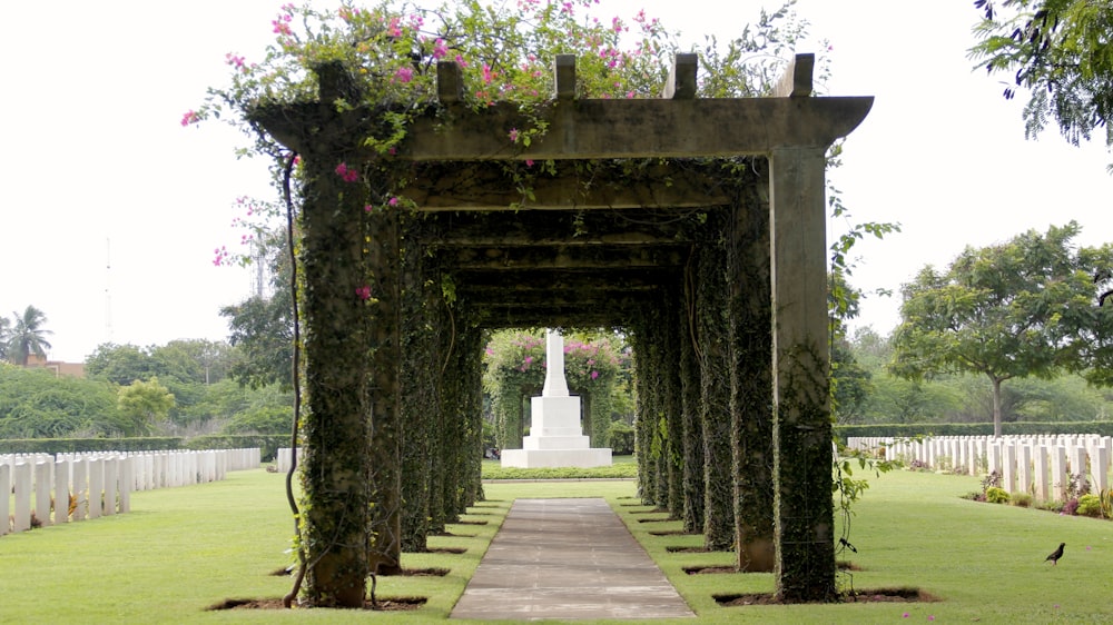 brown concrete pathway with arch gate