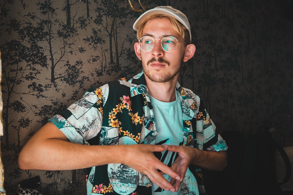 man in white and black floral crew neck t-shirt