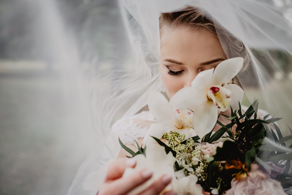 woman holding white flower bouquet