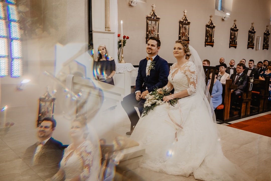 bride and groom standing on white floor