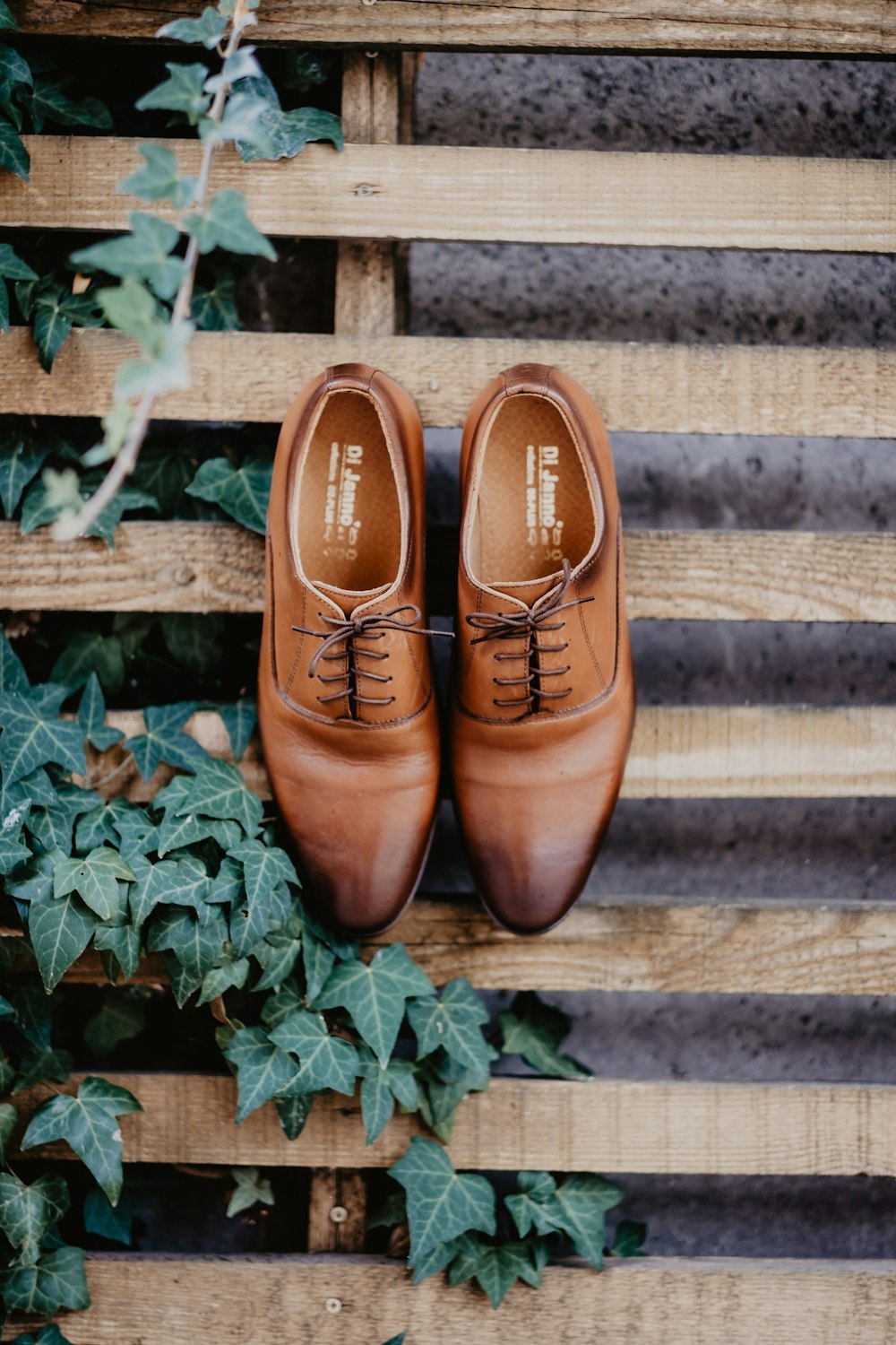 brown leather shoes on brown wooden stairs