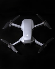 white and gray quadcopter drone