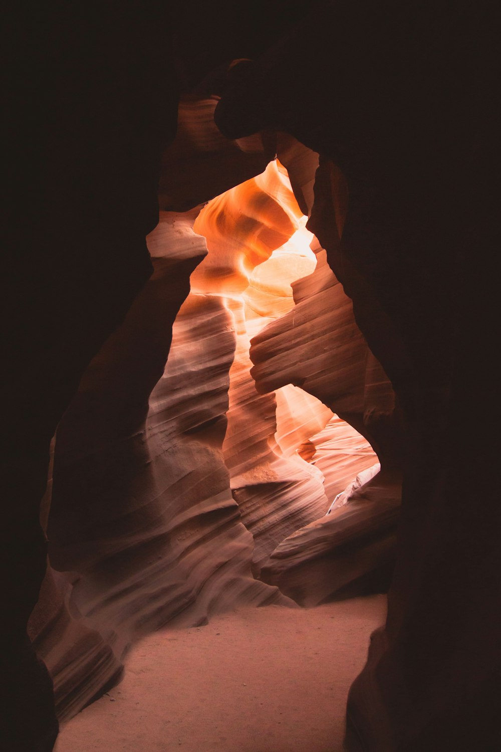 the light shines through the rocks in the desert