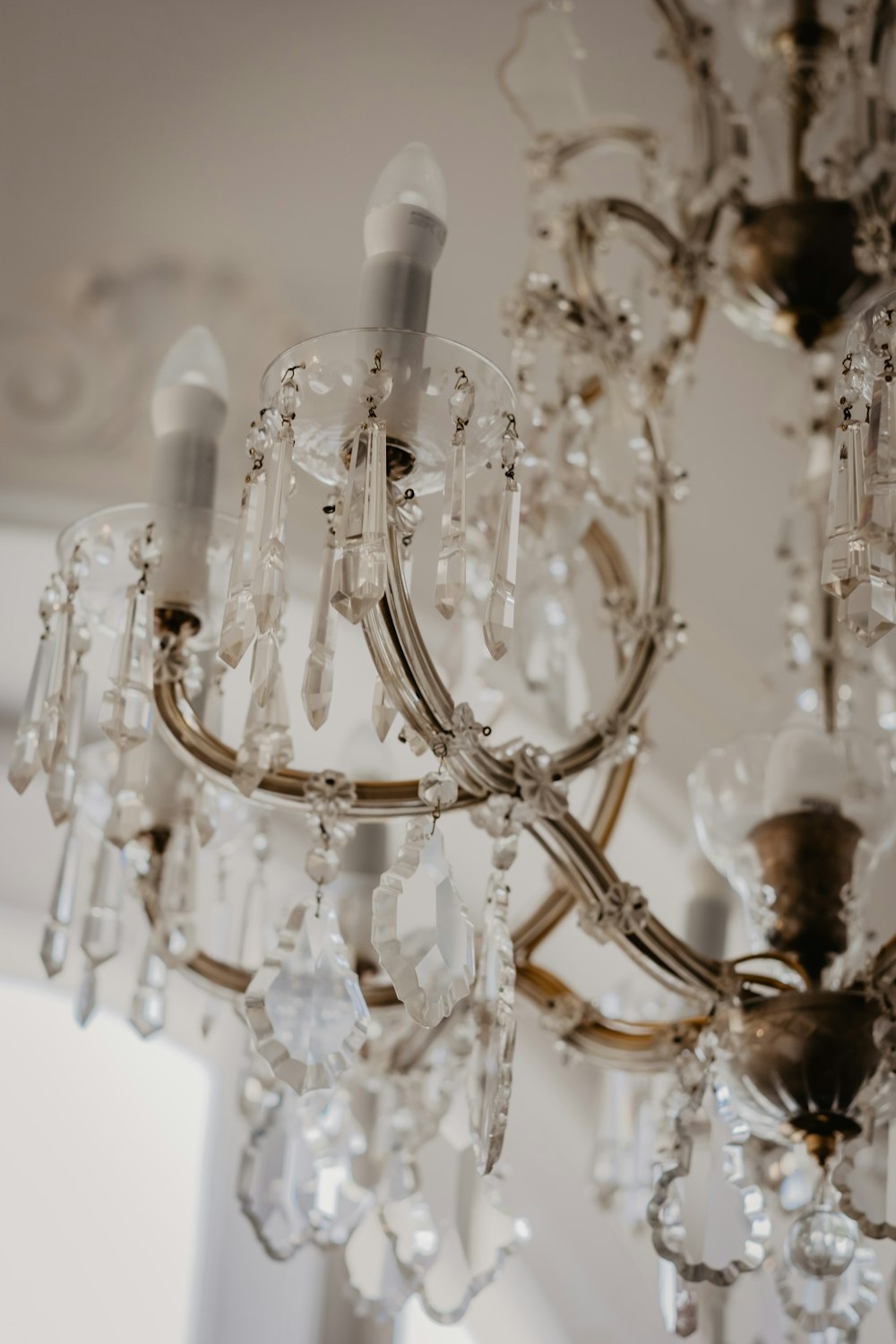 clear glass chandelier turned on in room