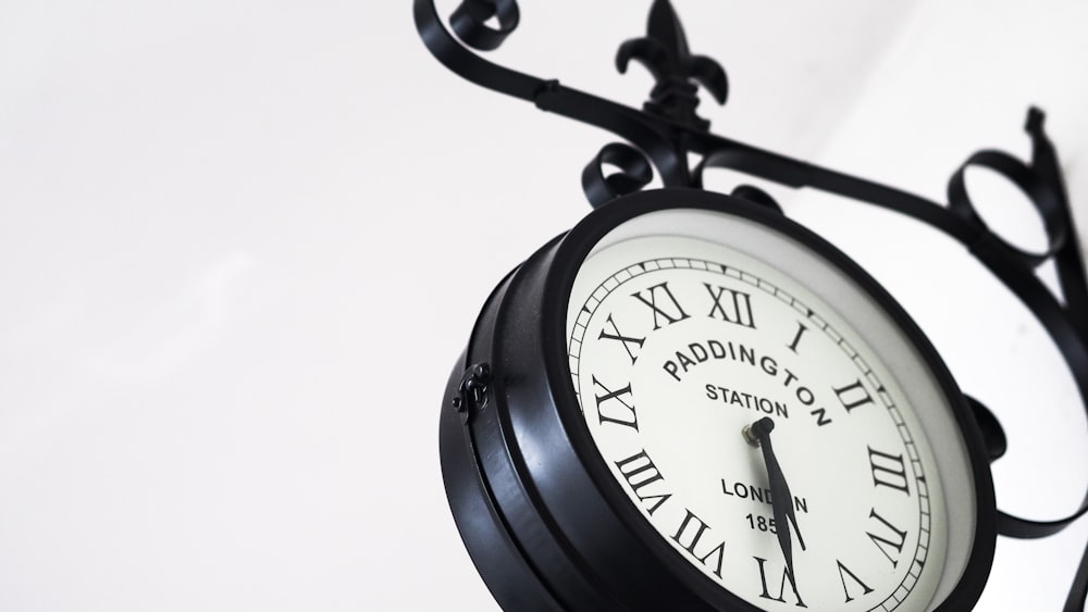 black and white analog alarm clock