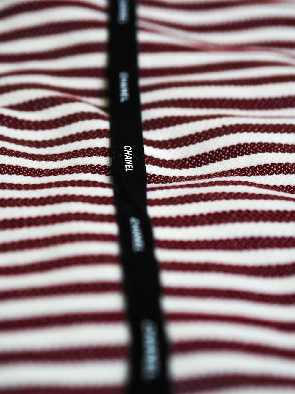 white and red stripe textile