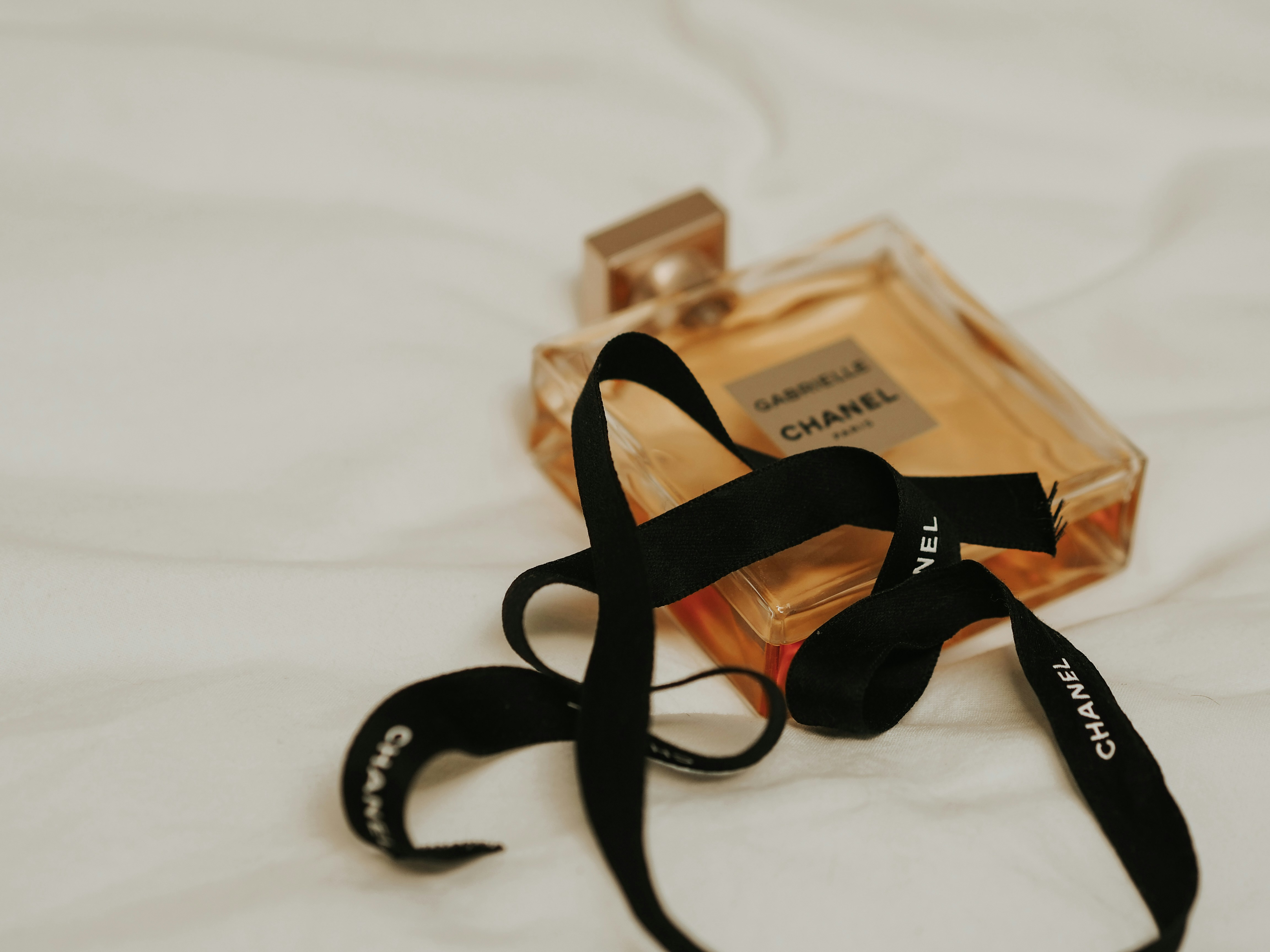 Ribbon and packaging detail in a soft luxury gift setting