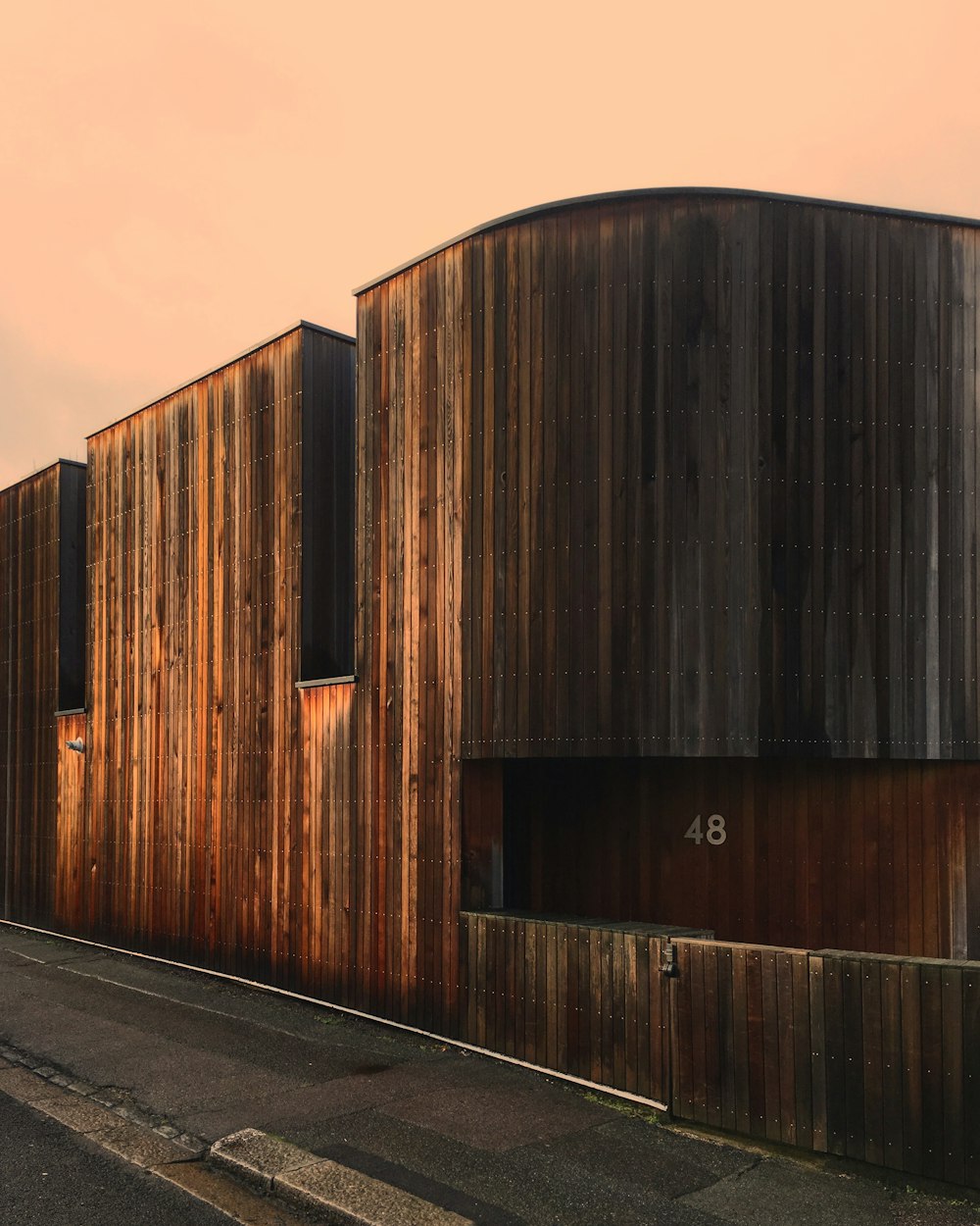 brown wooden wall under blue sky during daytime