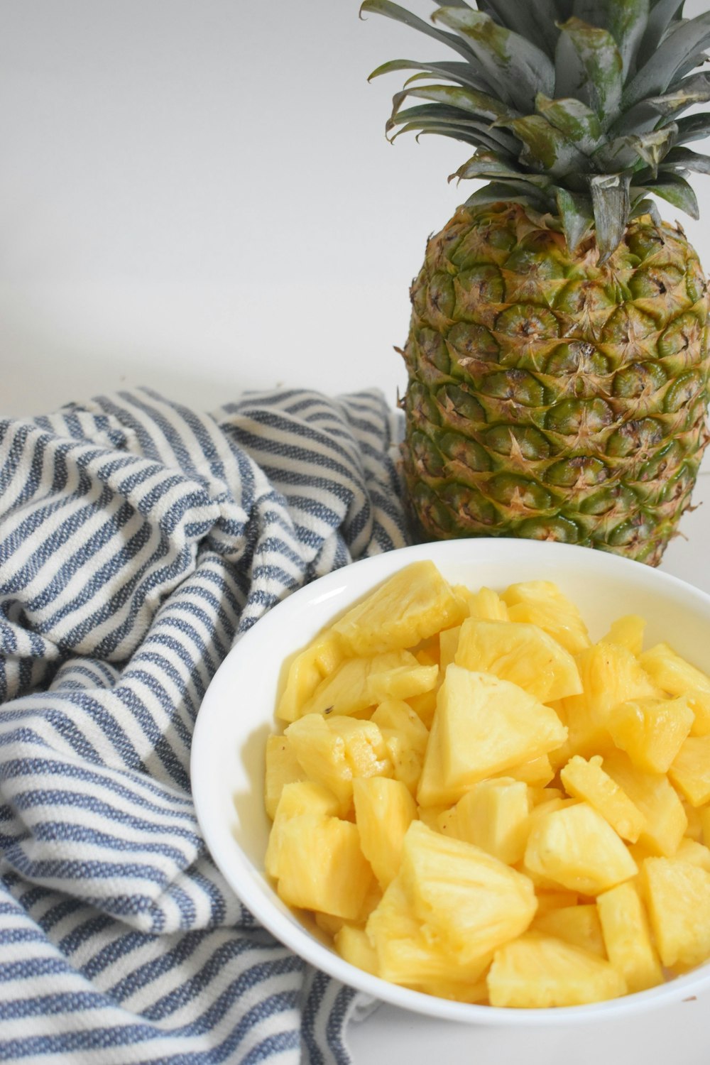 pineapple fruit on white ceramic plate