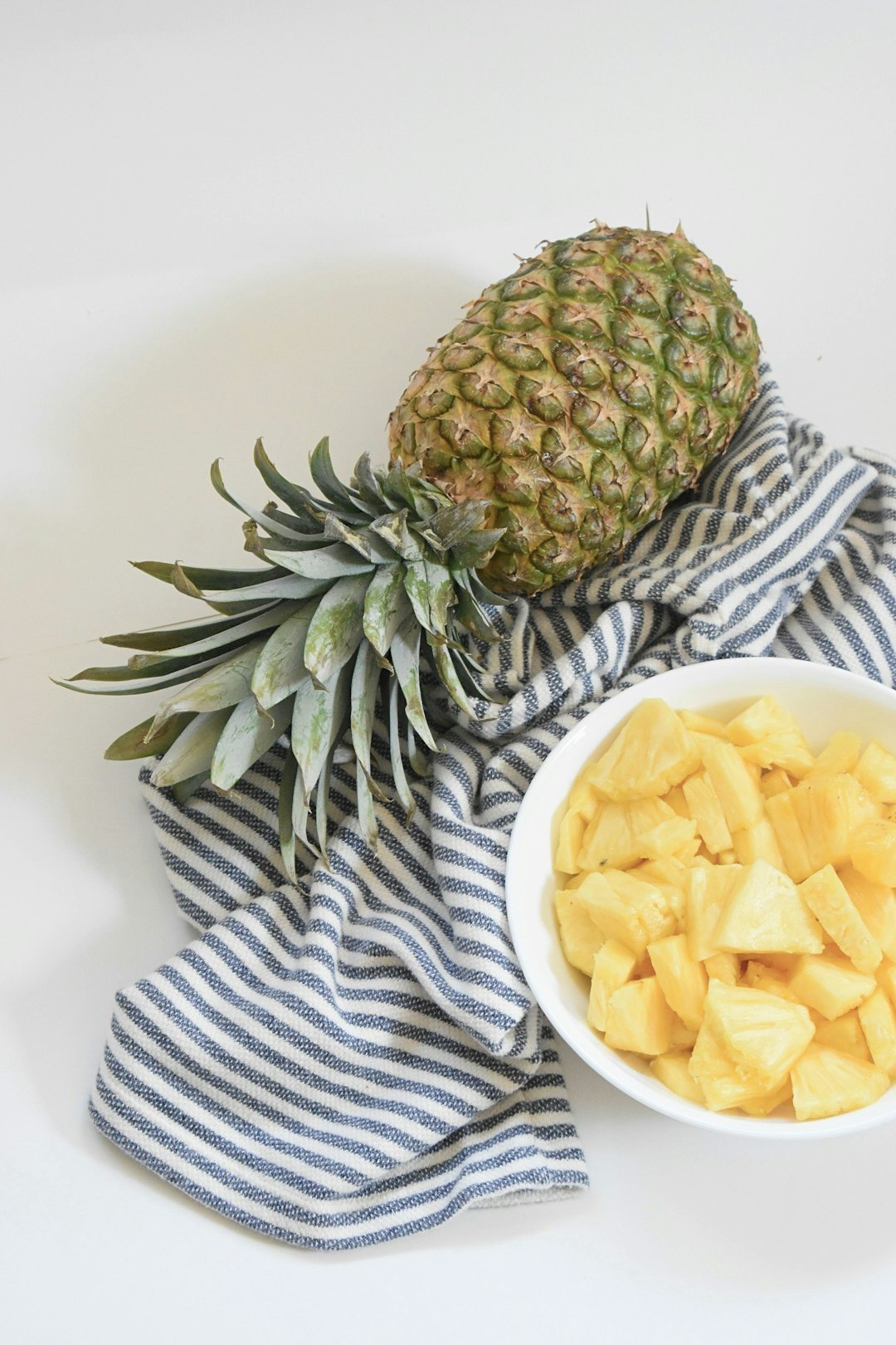 pineapple fruit on white ceramic plate