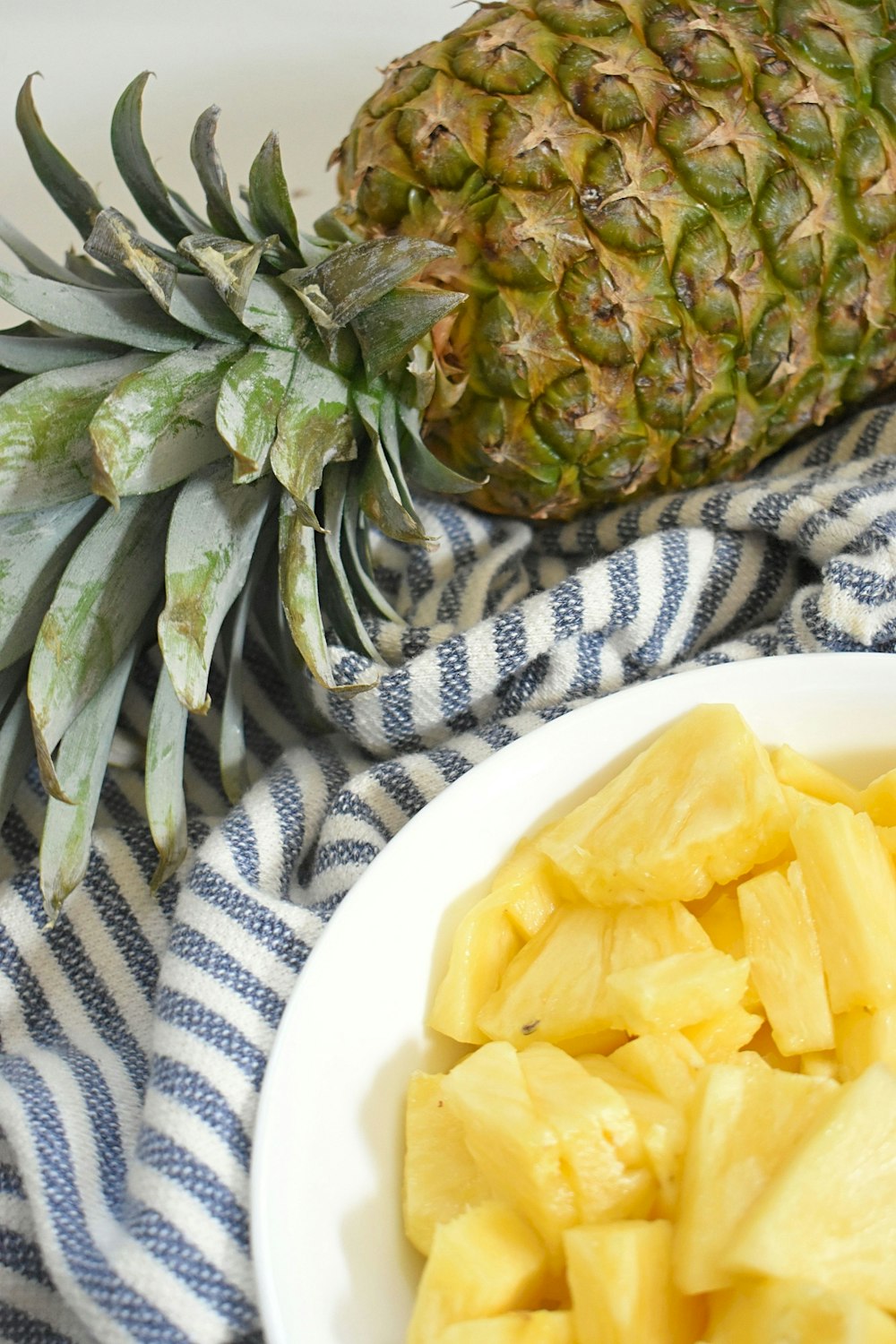 pineapple fruit on white ceramic plate