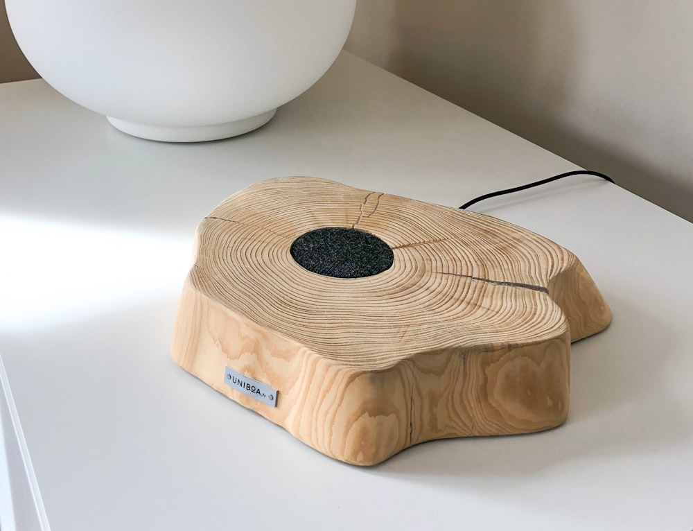 white ceramic bowl on brown wooden box