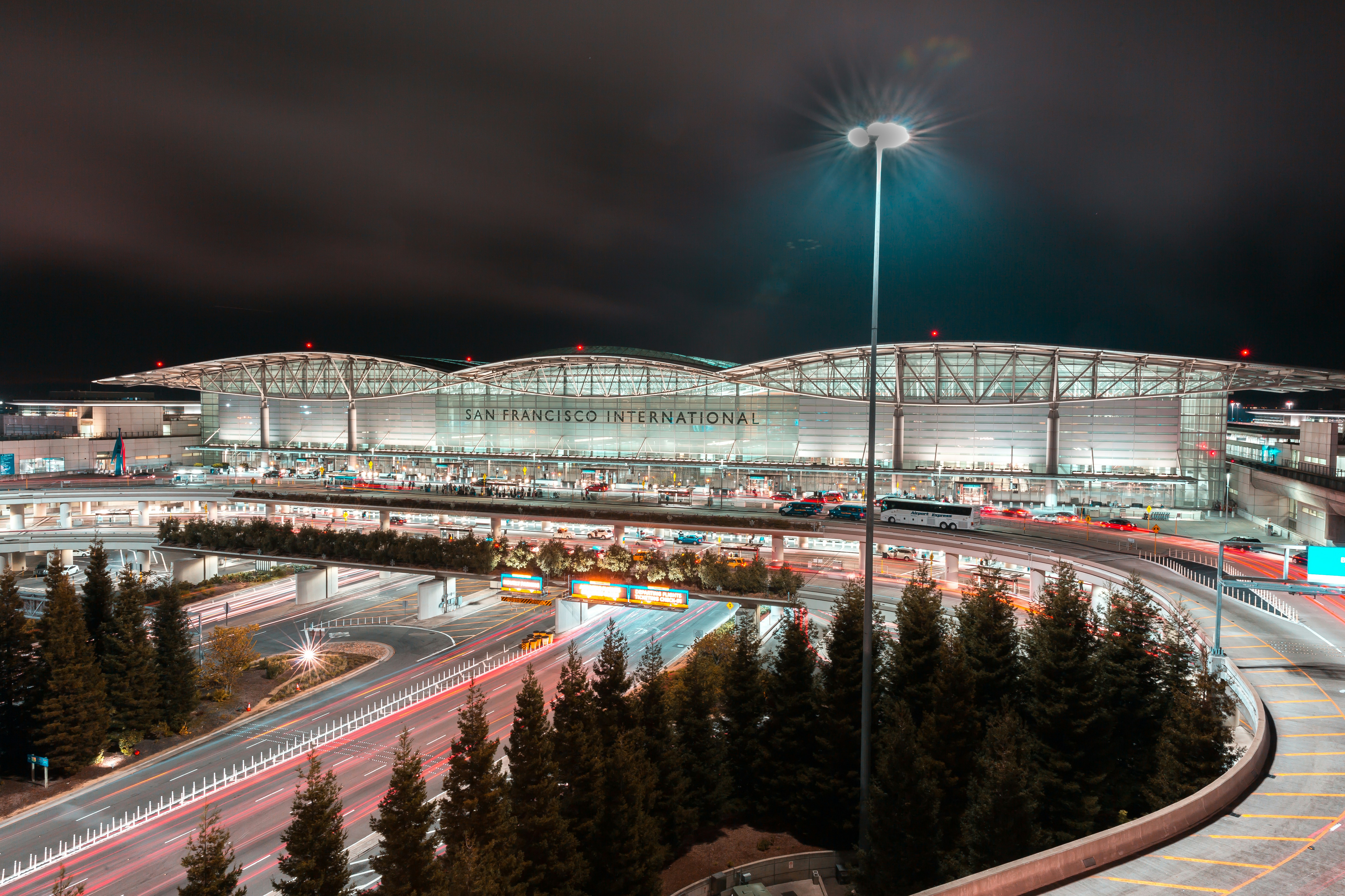 city buildings with lights turned on during night time