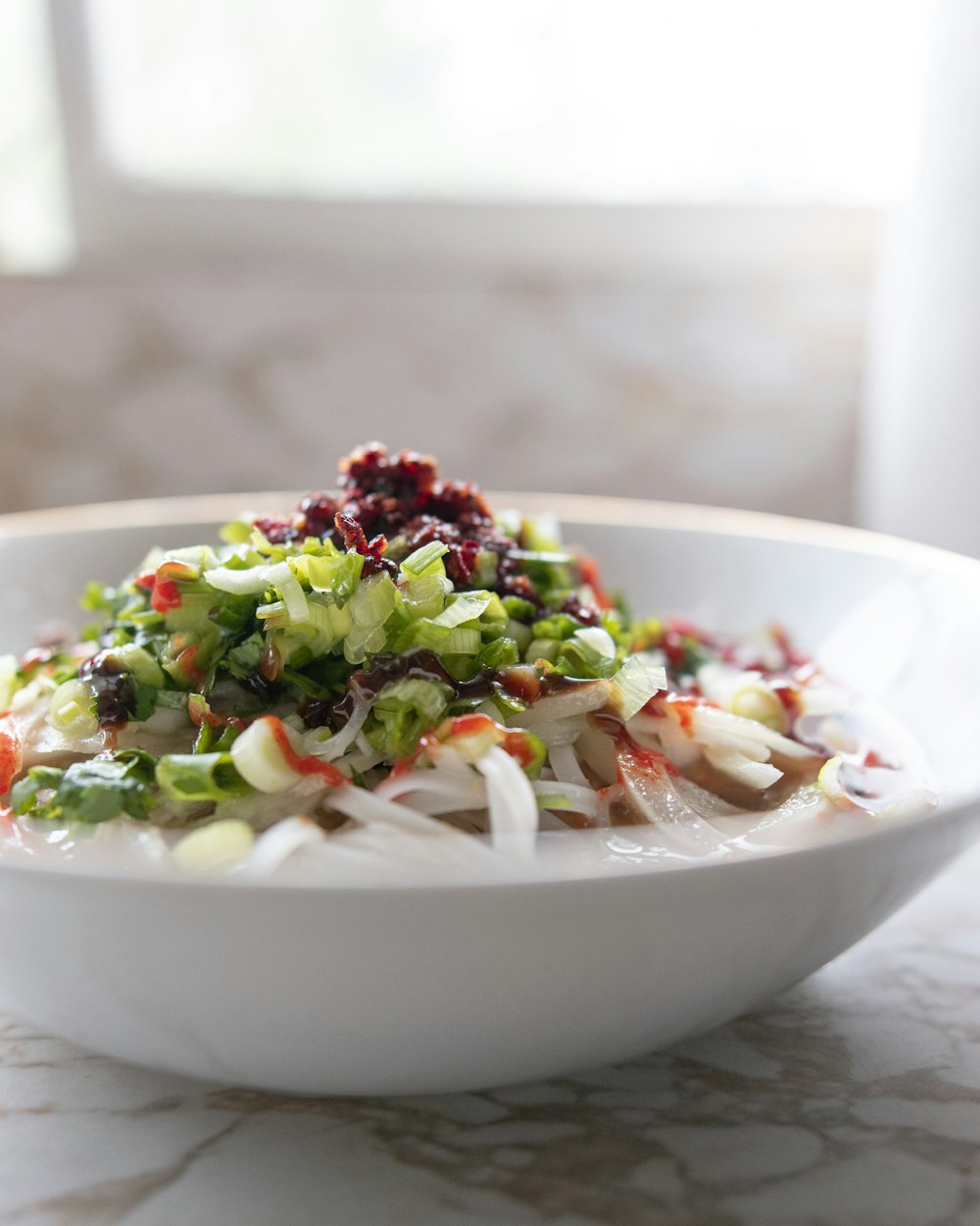 vegetable salad on white ceramic bowl