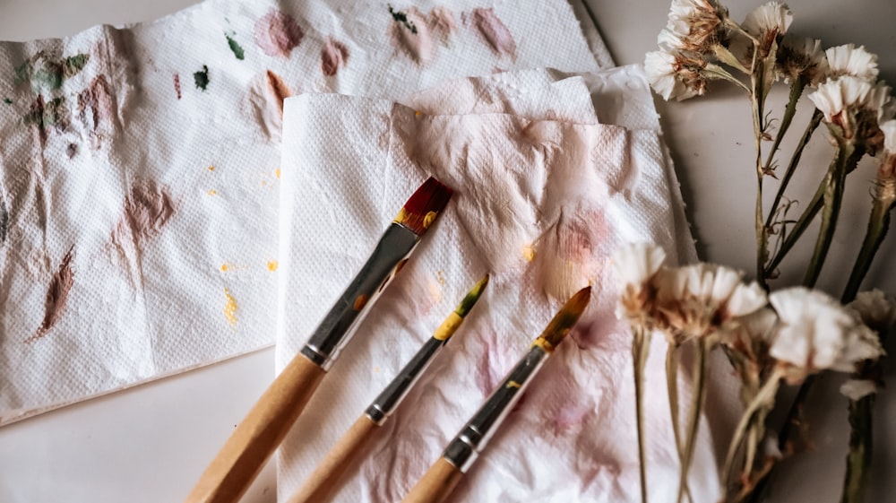 black and brown makeup brush on white tissue paper