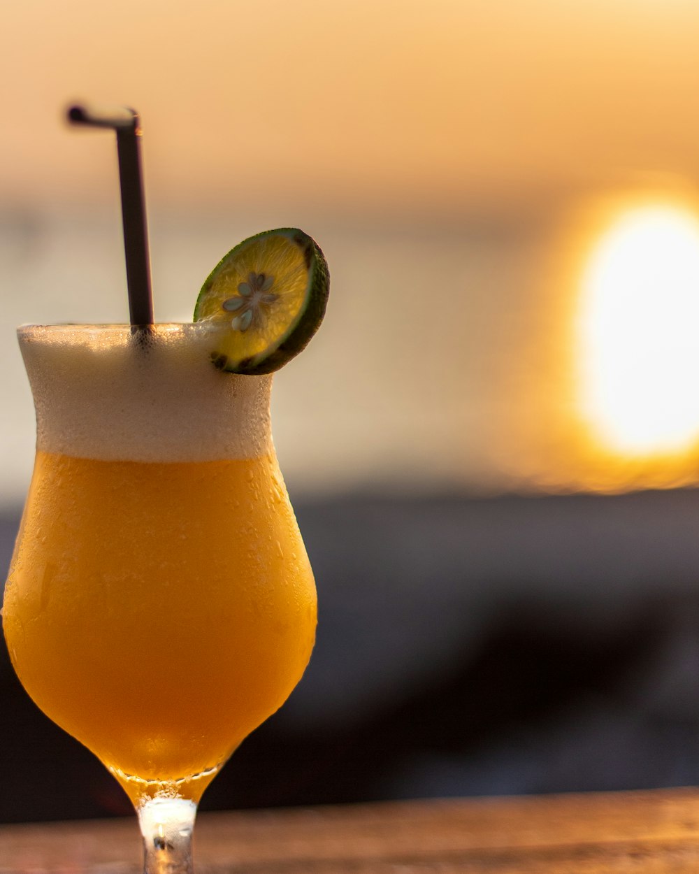 clear drinking glass with orange juice