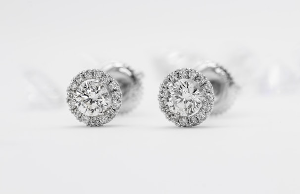 Shimmering diamond stud earrings sparkling under warm lighting