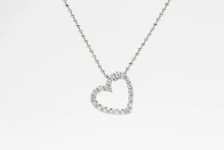 A delicate lab-grown diamond pendant glistening under soft light.