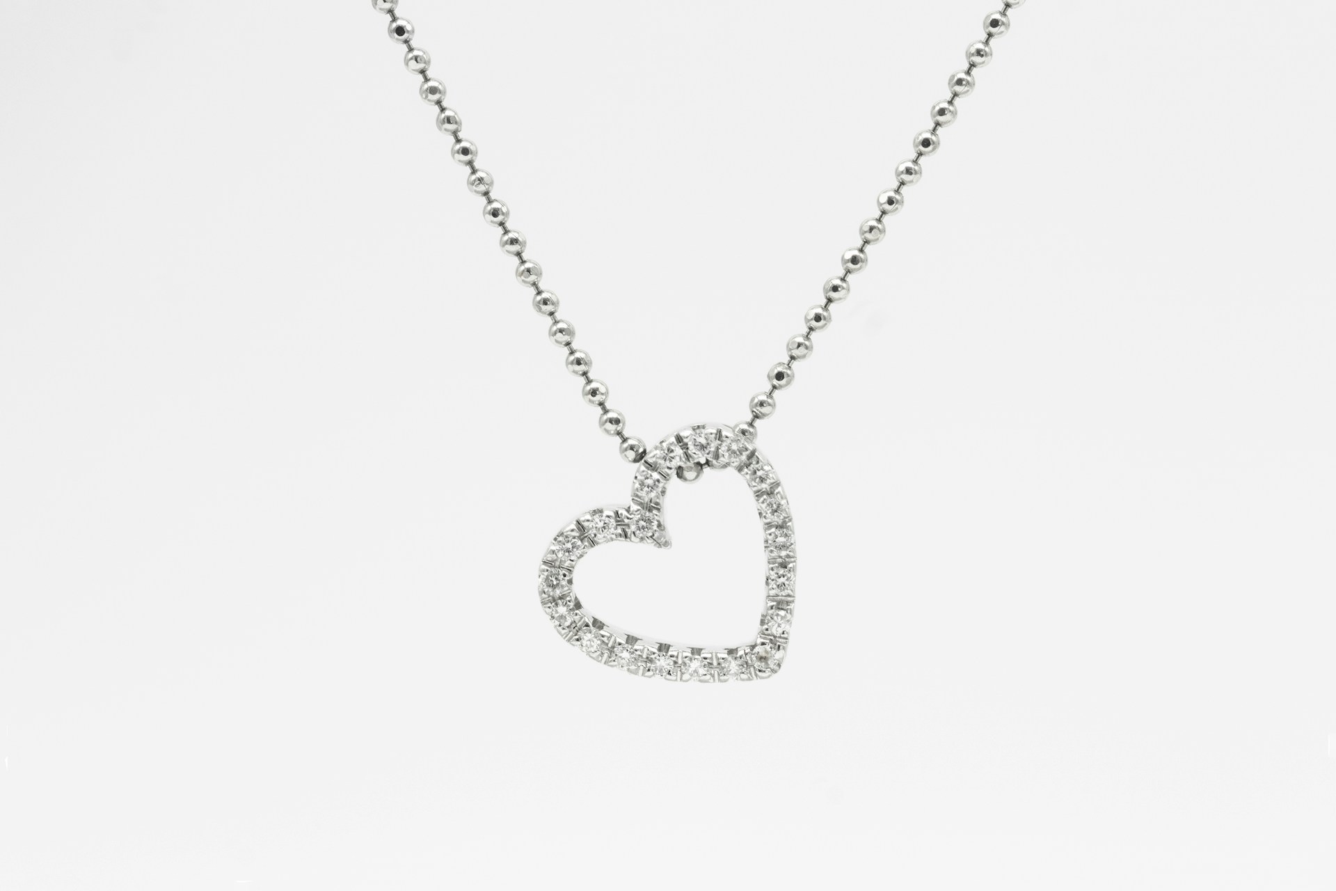 woman wearing yellow long-sleeved dress under white clouds and blue sky during daytime