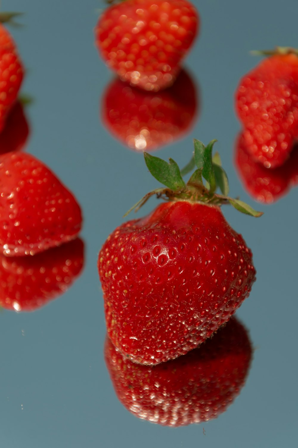 red strawberries on white surface