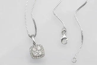 Elegant silver necklace packaged carefully in a sleek black box ready to ship.