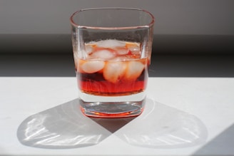 clear drinking glass with red liquid
