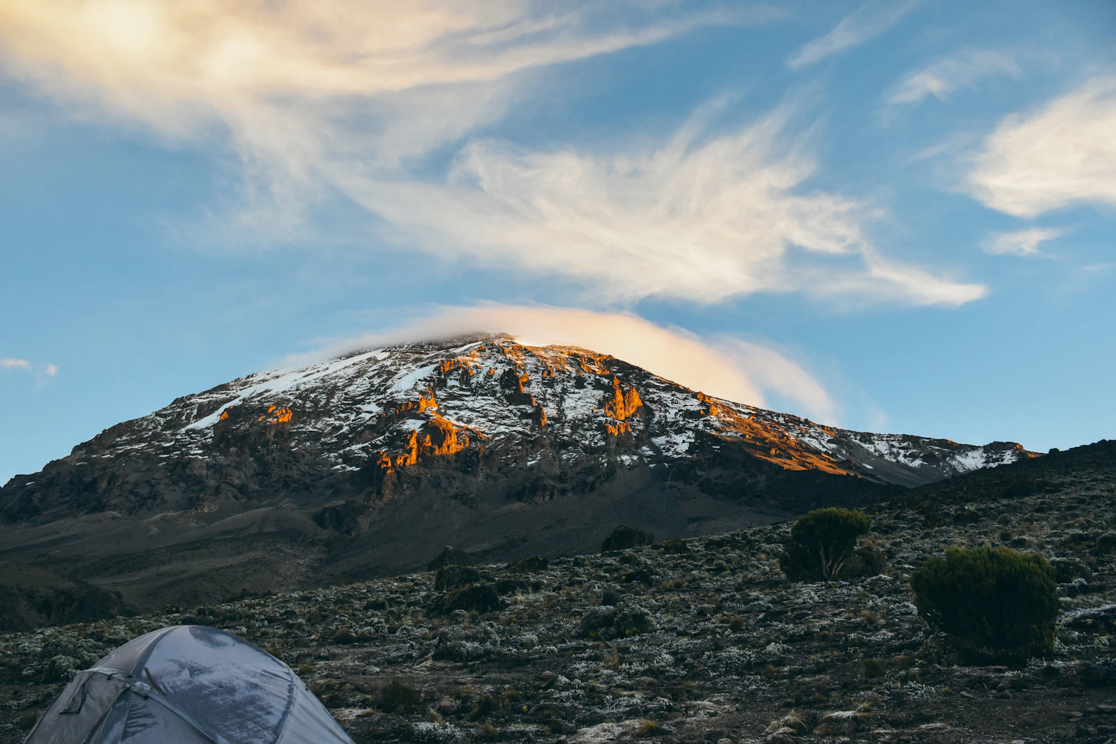 A mountain camp on Kilimanjaro under an open evening sky