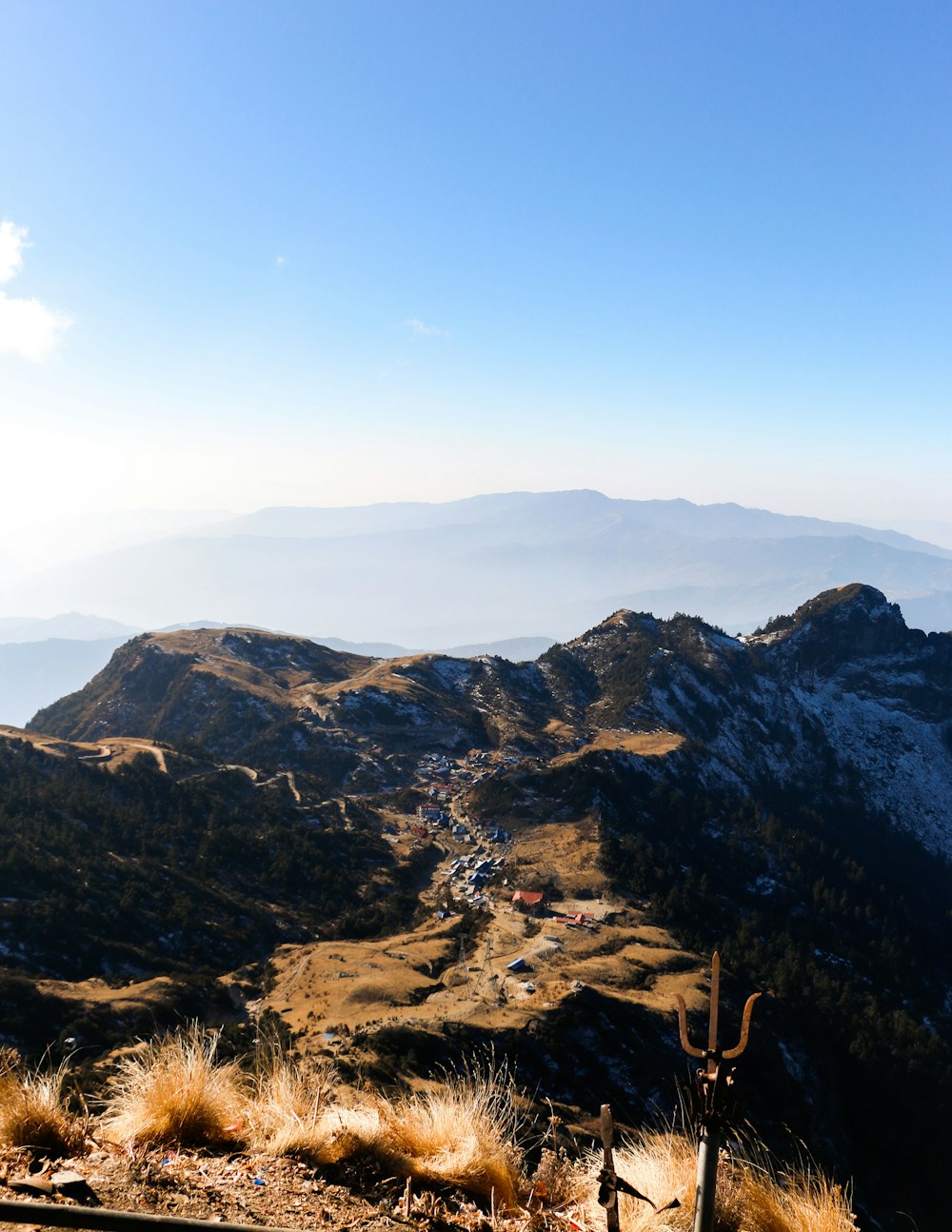 brown and black mountains under blue sky during daytime