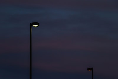 black street light during night time post-impressionism teams background