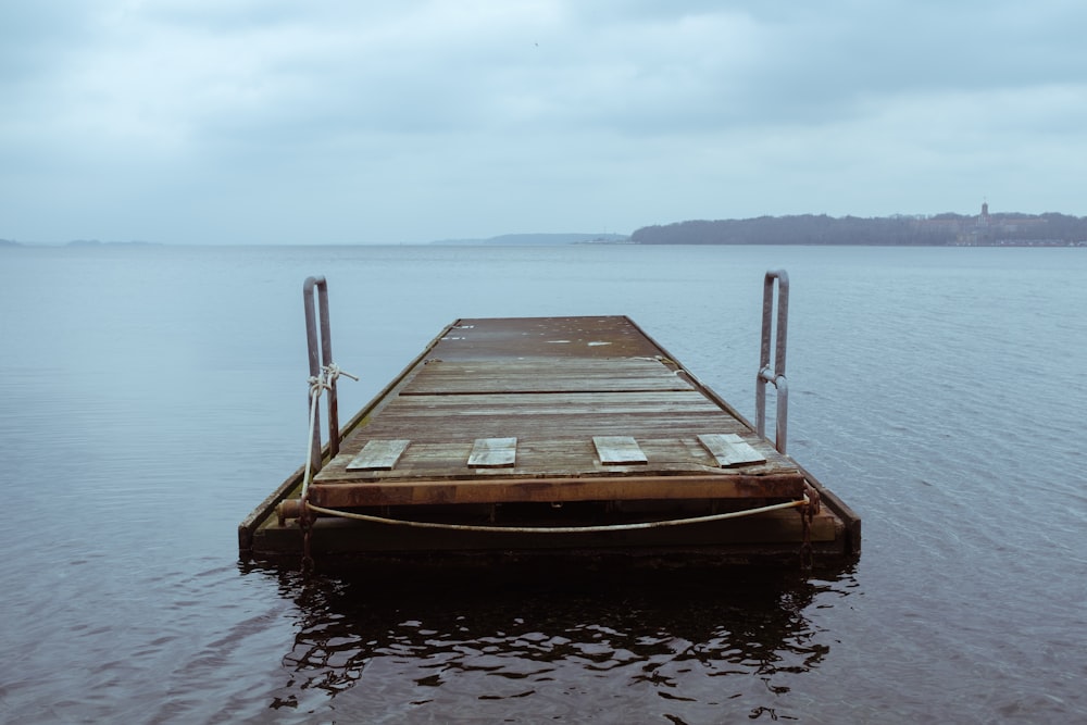 brown wooden boat on water during daytime