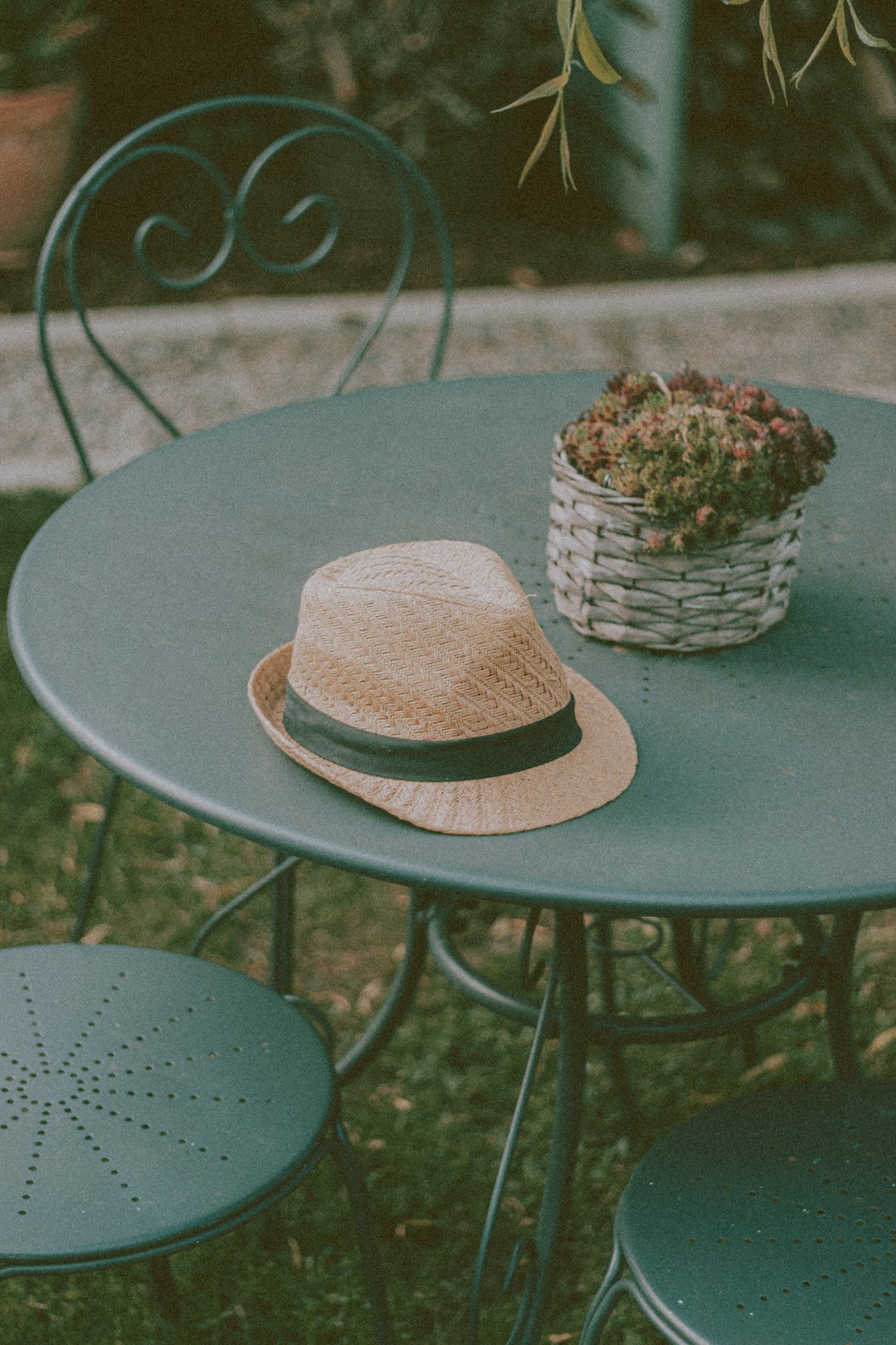 brown woven hat on blue round table