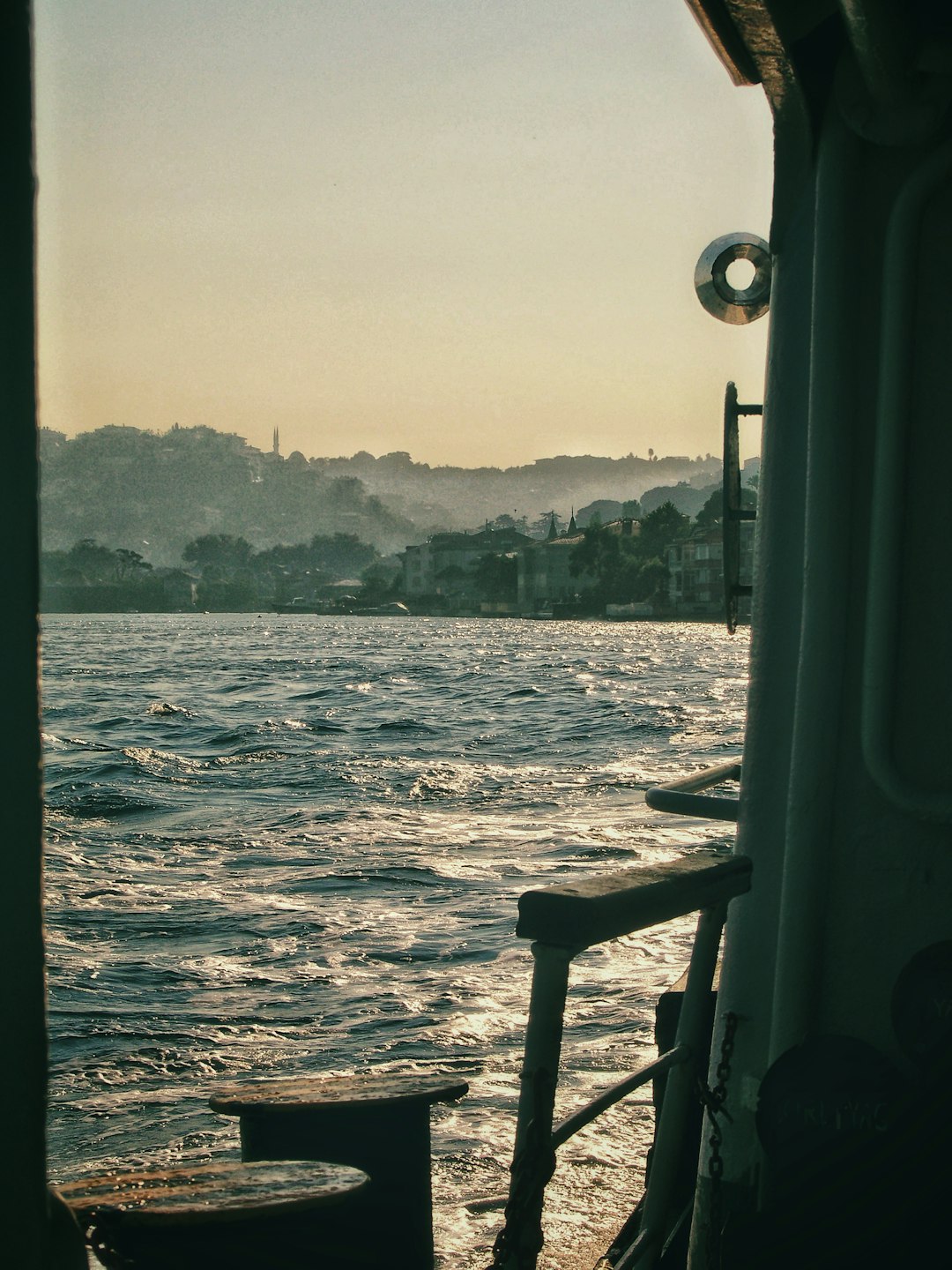 body of water near mountain during daytime