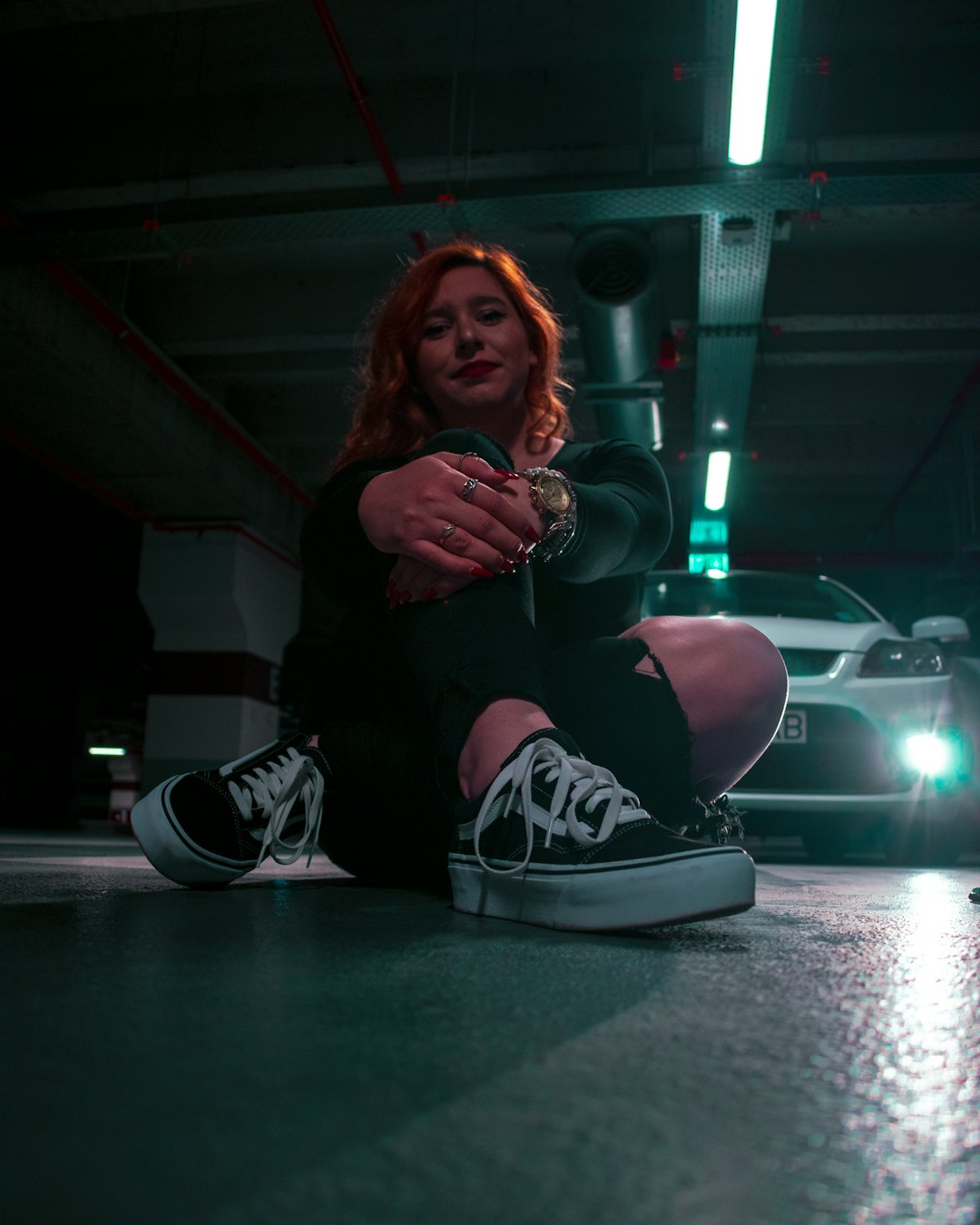 woman in black long sleeve shirt sitting on floor