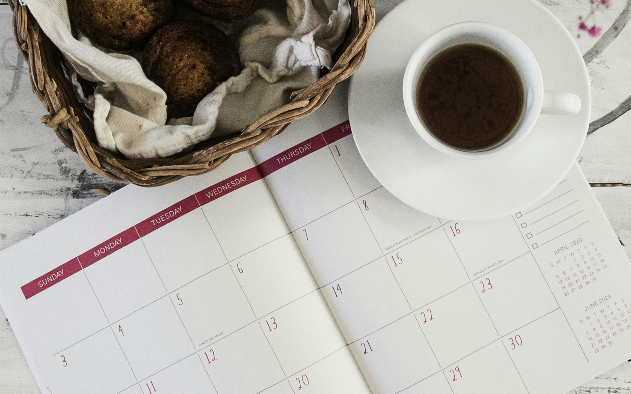 Calendar with muffins and coffee cup