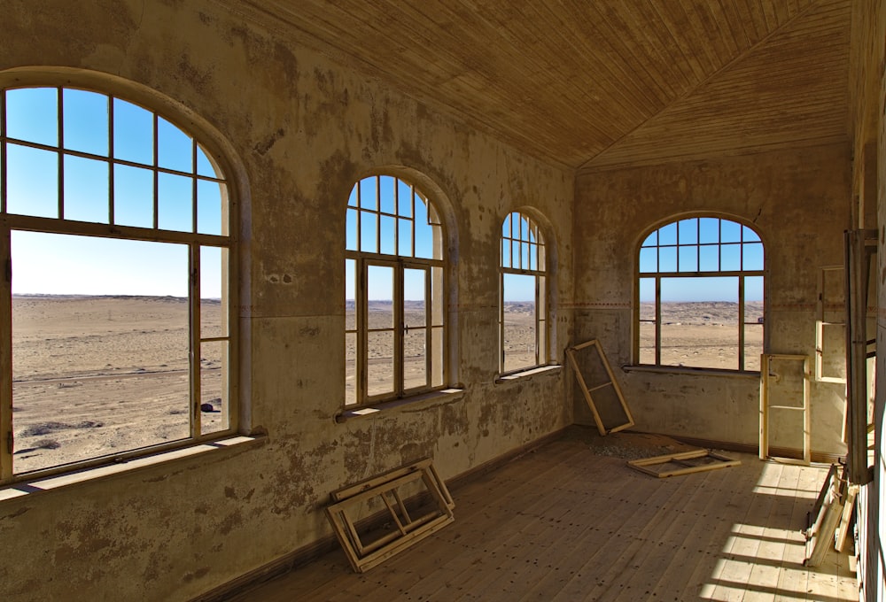 brown wooden bench near window